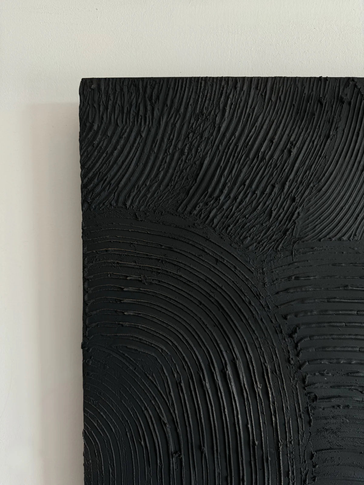Undercurrent — carved plaster relief in graphite